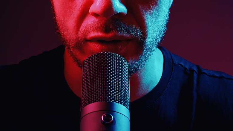 man speaking into a microphone