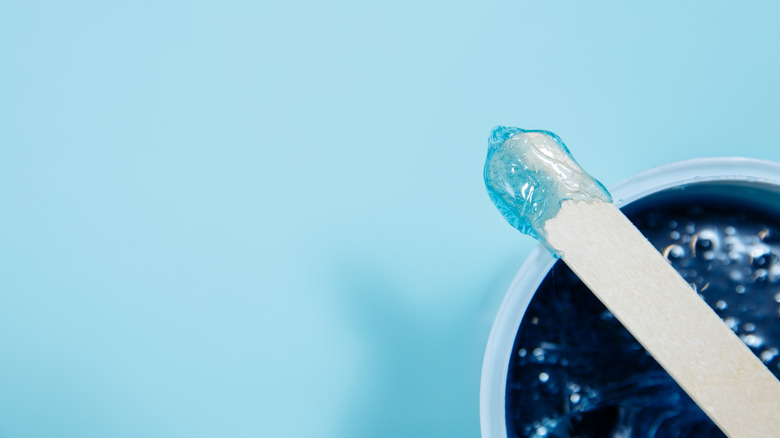 Wax with spatula applicator