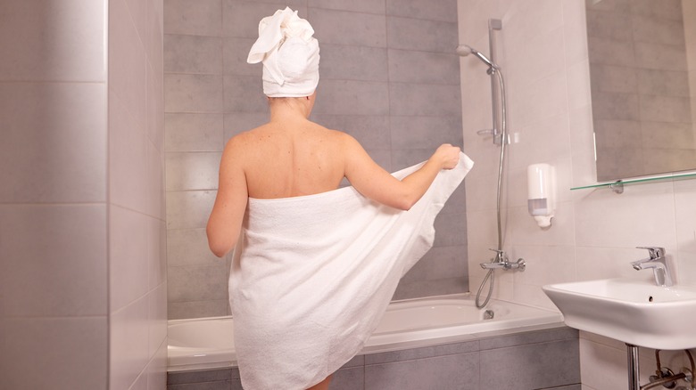 Woman drying off after a shower