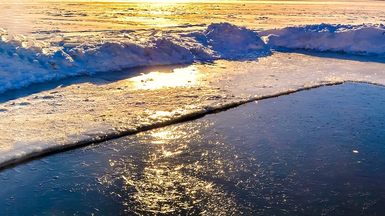 snow and ice on top of a lake