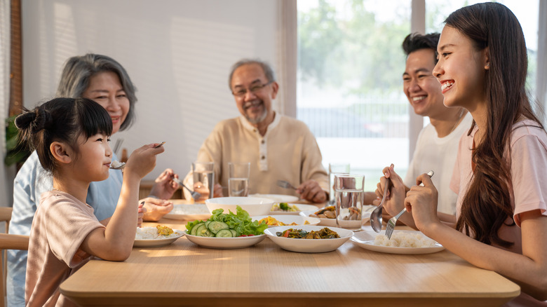 Family eating dinner together