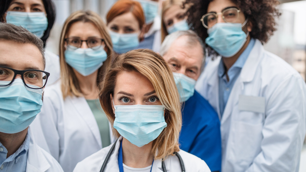 group of doctors with face masks