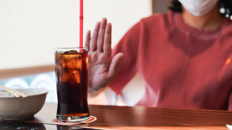 Woman saying no to soda