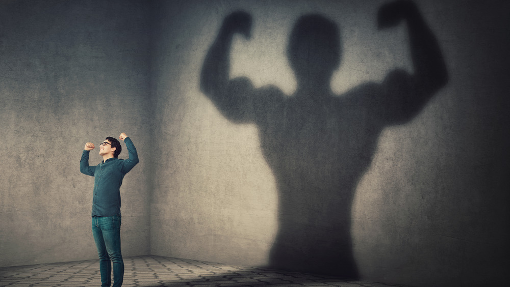 Man casting muscular shadow