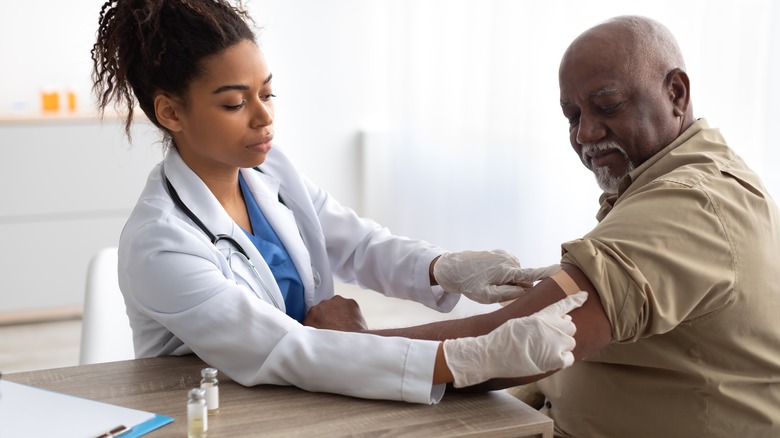 older man getting vacccinated