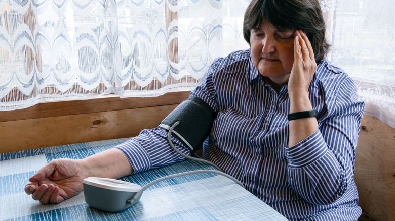 mature woman reacting to poor blood pressure reading