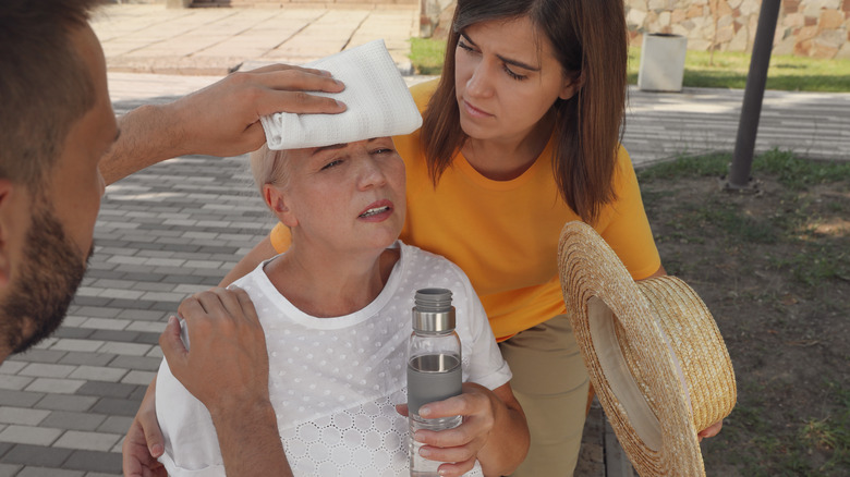 Mature woman with heat illness