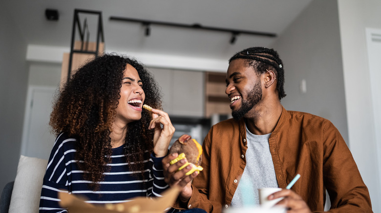 Partners eating together