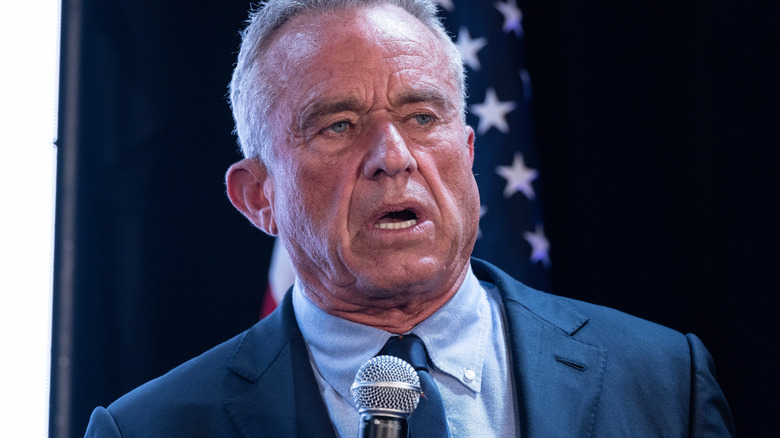 Robert F. Kennedy speaking into a microphone