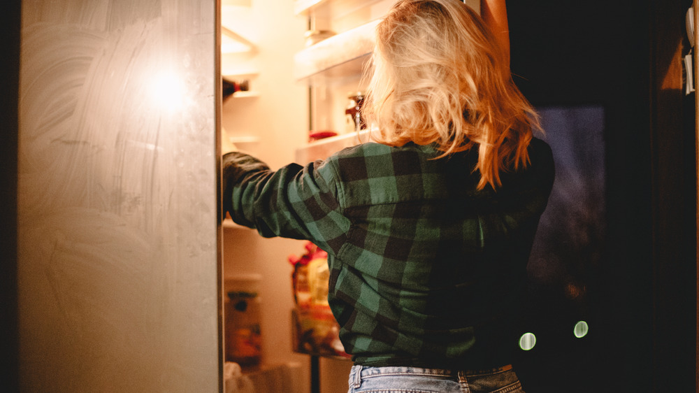 woman eating ice cream at night