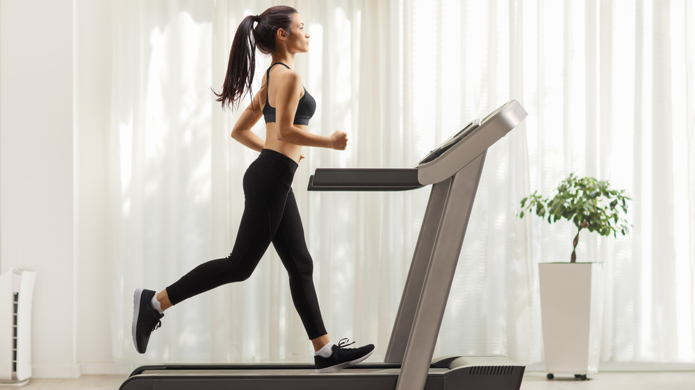 woman running on treadmill