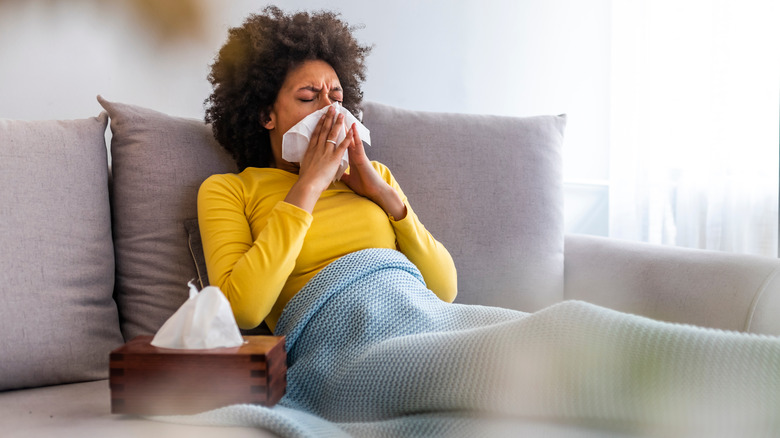 woman sneezing