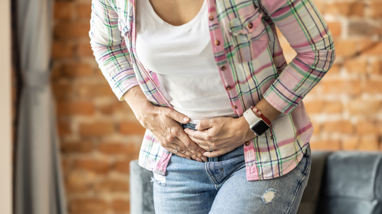 A woman experiencing severe gallbladder pain