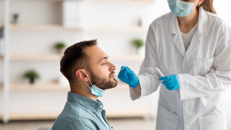 A patient getting tested for COVID