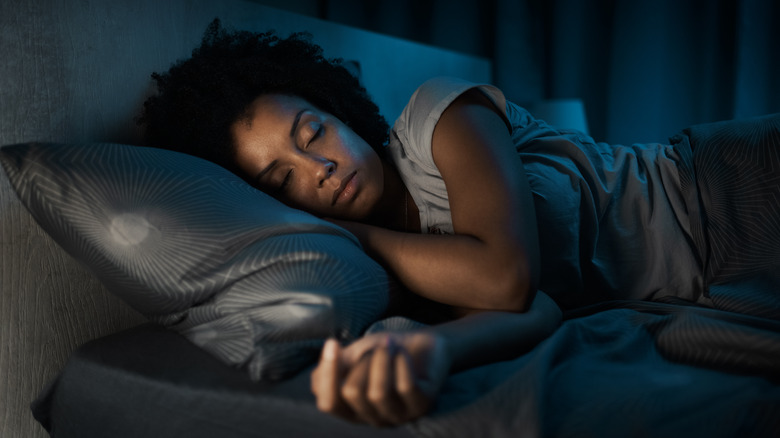 Woman asleep in bed