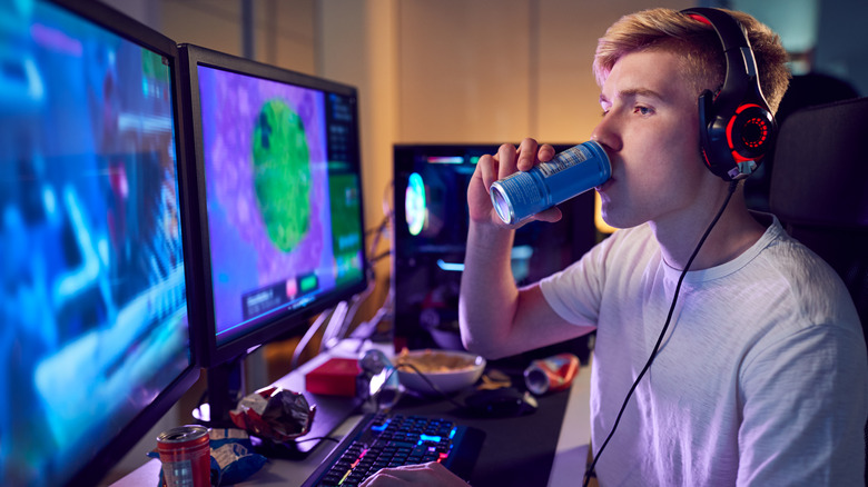 teenage boy drinking energy drink