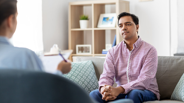 Man in therapy session