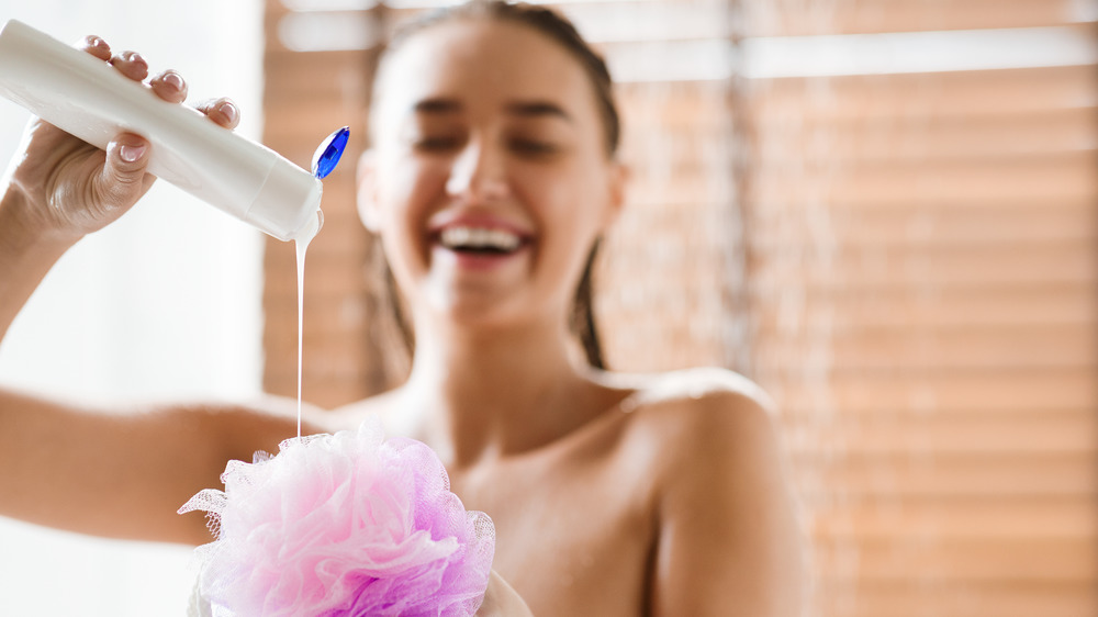 Woman holding shower product