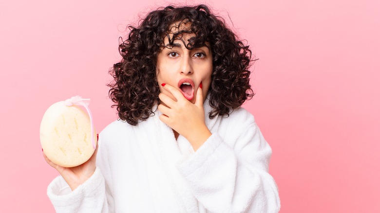 shocked woman holding soap