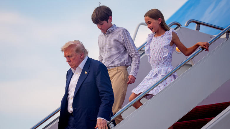 President Donald Trump with two of his grandchildren
