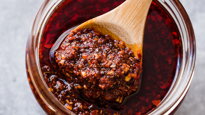 wooden spoon in salsa jar