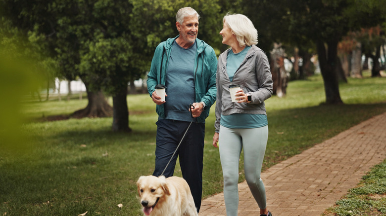 older couple walking in a park