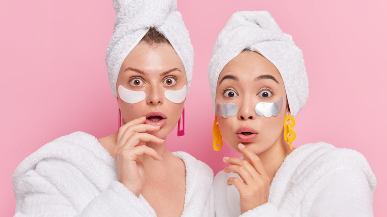 two women wrapped in towels