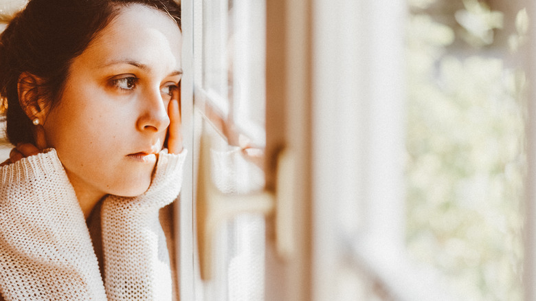 Woman looking out the window