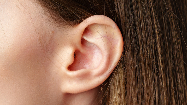 A close-up shot of a woman's ear