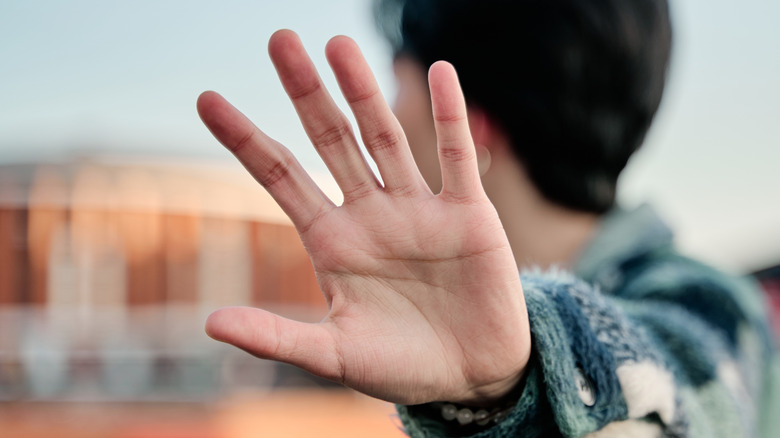 A man holding out his hand