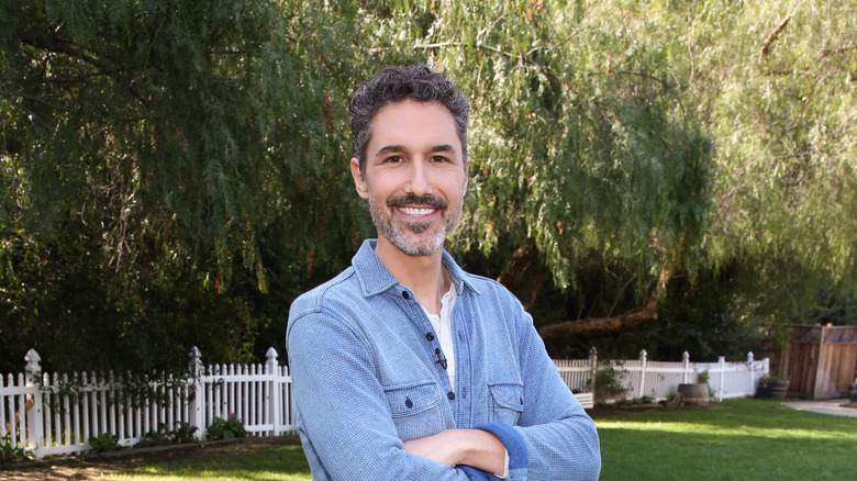 Ethan Zohn standing outside smiling