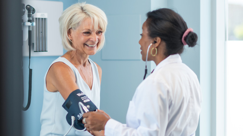 Woman getting her blood pressure checked