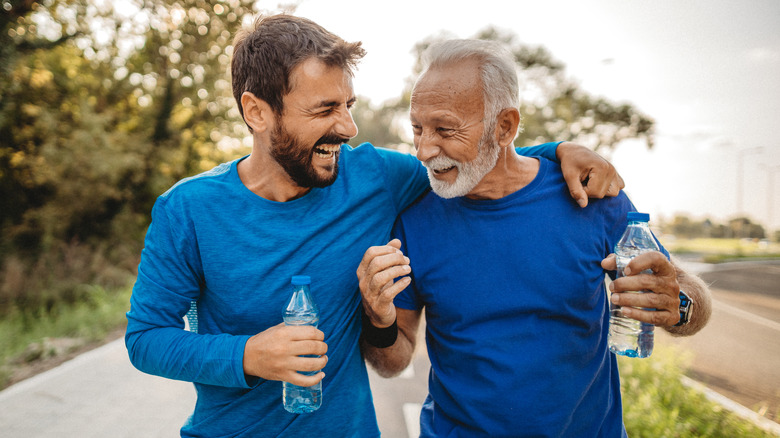 older man and son laughing