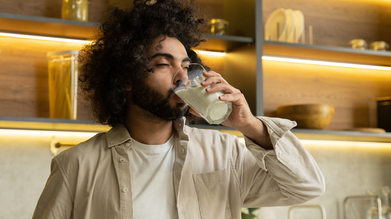 Man drinking glass of milk