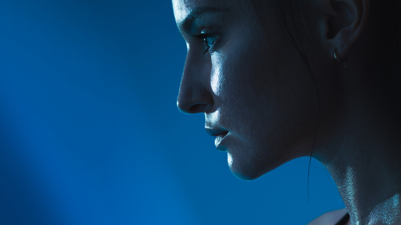An active women in profile in shades of blue