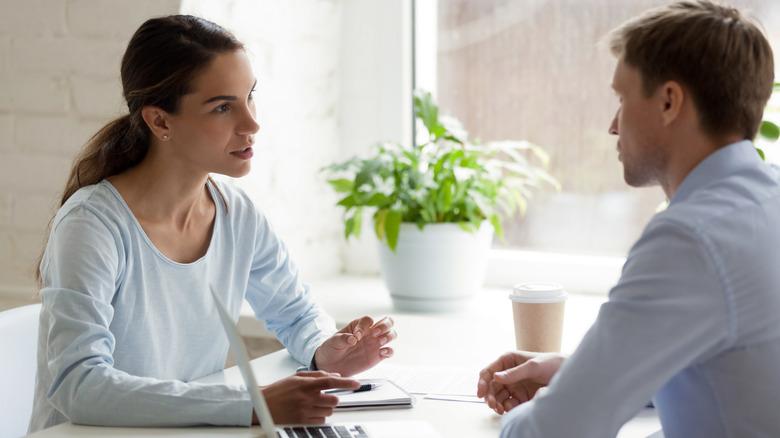 coworkers speaking with each other