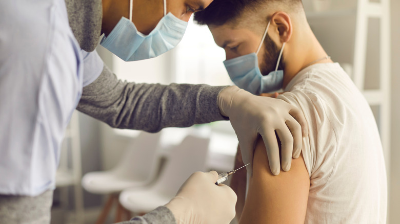 Young man receiving vaccine