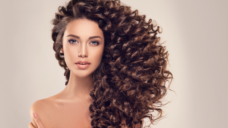 Woman with shiny curly hair