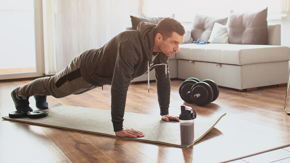 man doing high plank