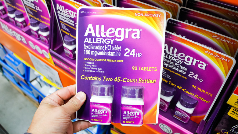 Person holding Allegra package