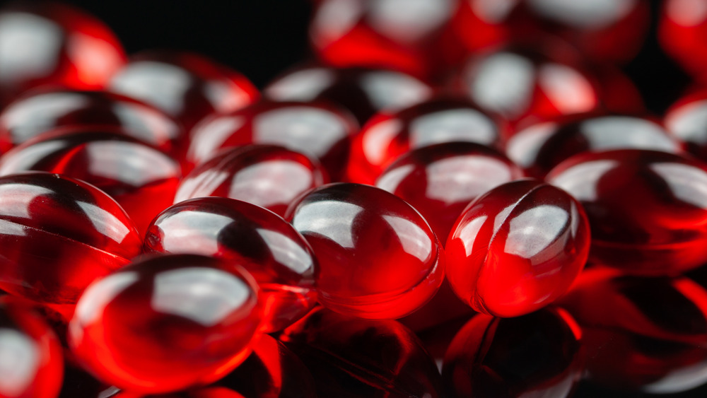Close up of krill oil supplements on black background