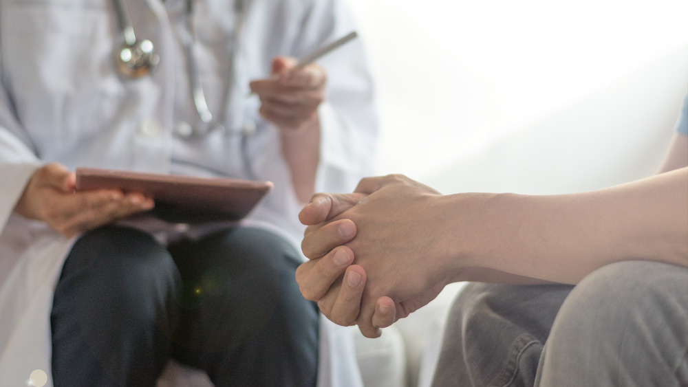 Man sitting with his doctor