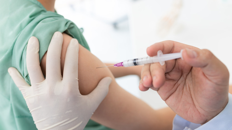 Medical provider administering a vaccine