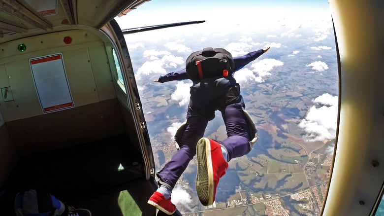 leaping out of plane with parachute