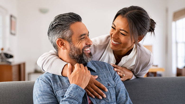 Man and woman smiling at each other