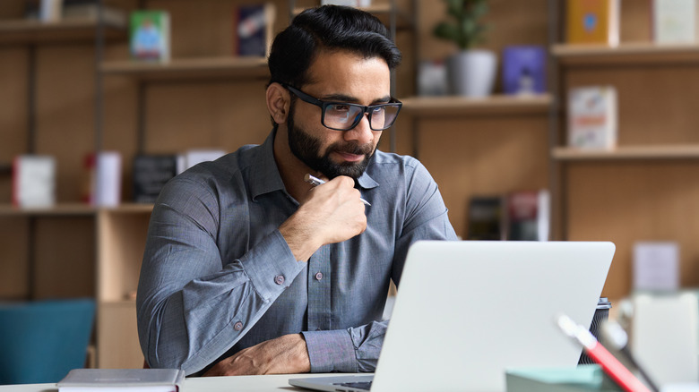 Man looking at laptop screen