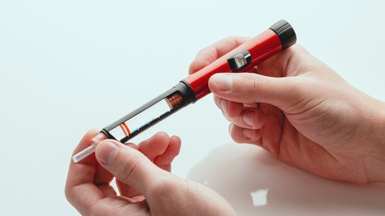 Diabetic checking blood sugar levels