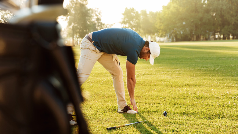 Stretching while playing golf