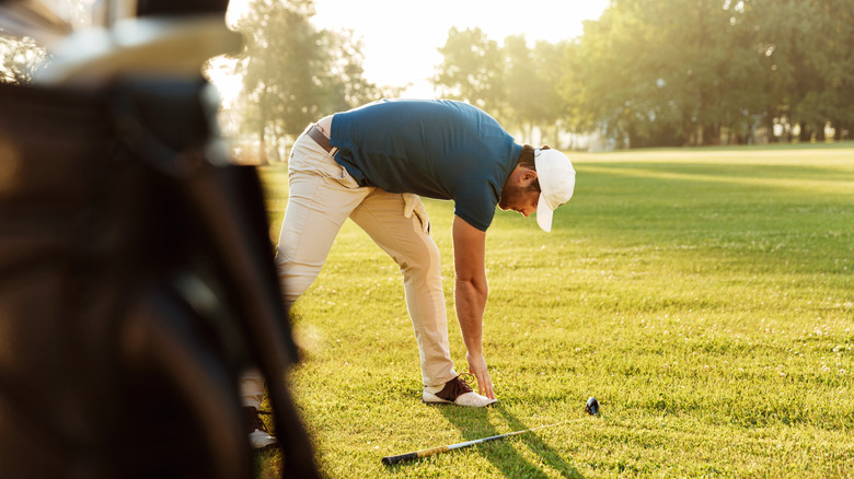 Stretching while playing golf
