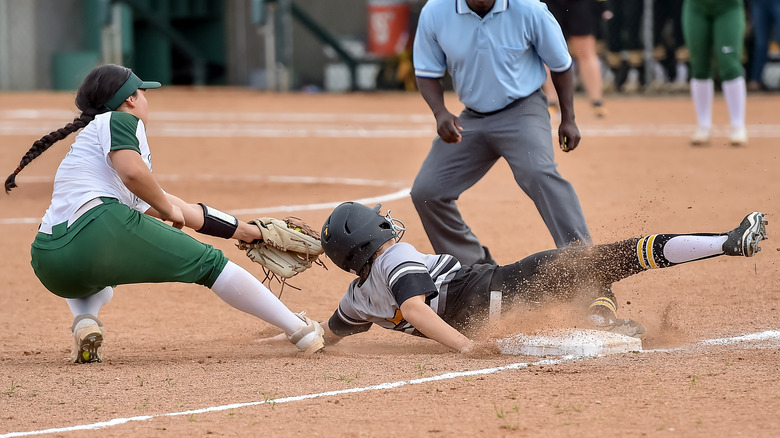A player sliding in a softball game